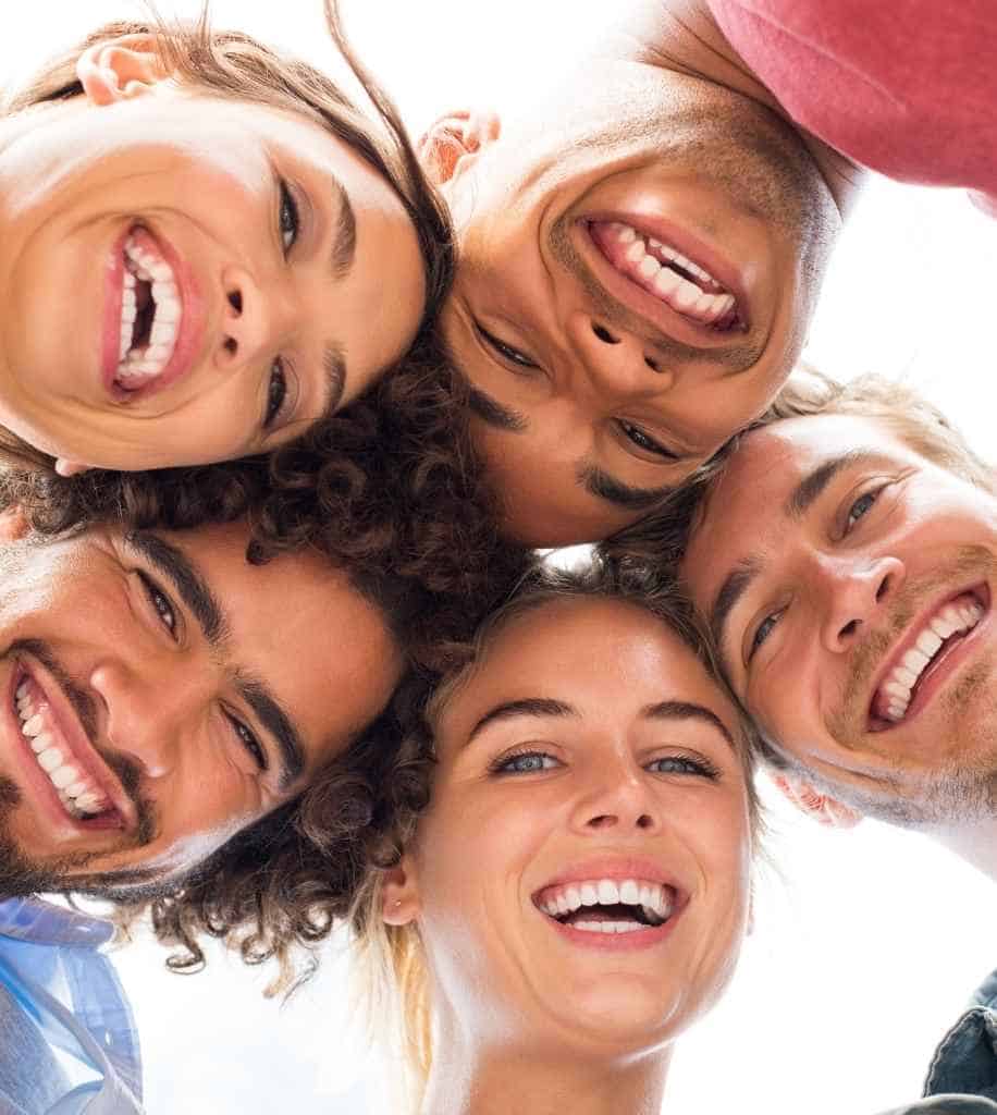 Smiling person showcasing white teeth after laser whitening treatment Huddersfield